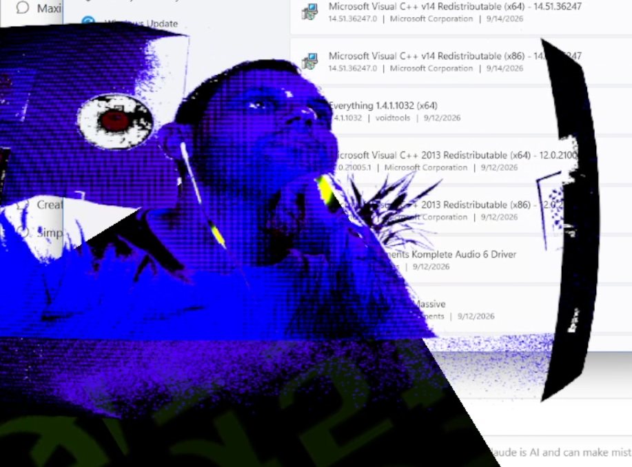 Webcam shot of Trev with a purple glitch effect over his desktop